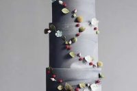 an adorable grey wedding cake decorated with dried blooms and sugar flowers is a stylish and catchy idea for a wedding