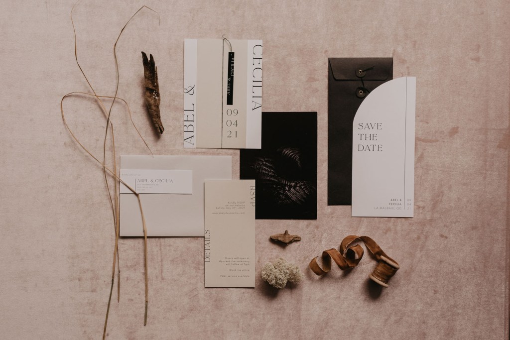The wedding invitation suit was done in neutrals and white, with modern lettering