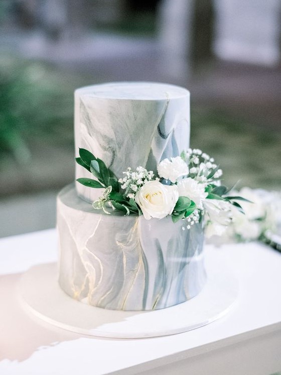 a grey marble wedding cake with greenery and white blooms is a gorgeous idea with a timeless feel