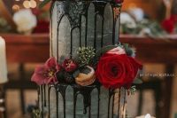 a moody watercolor wedding cake