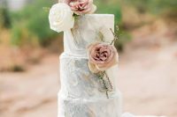 a refined grey marble wedding cake with gold touches and mauve and white blooms and greenery is a chic idea for a spring wedding