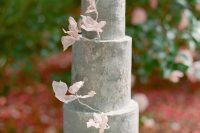 a textural grey wedding cake decorated with blush blooms is a lovely idea for a spring or summer wedding