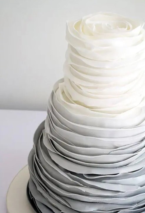 An ombre grey tiered ruffle wedding cake is a statement like dessert to rock at your grey wedding