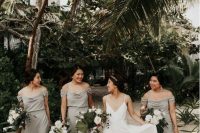 elegant grey cold shoulder maxi bridesmaid dresses with updos and statement earrings
