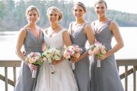 matching maxi grey bridesmaid dresses with straps, draped bodices and V necklines for a spring or summer wedding