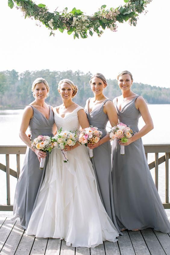 matching maxi grey bridesmaid dresses with straps, draped bodices and V necklines for a spring or summer wedding