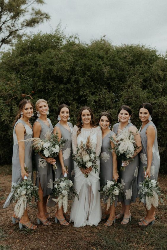 midi grey sleeveless bridesmaid dresses with white floral patterns and grey shoes are chic for a spring or summer wedding