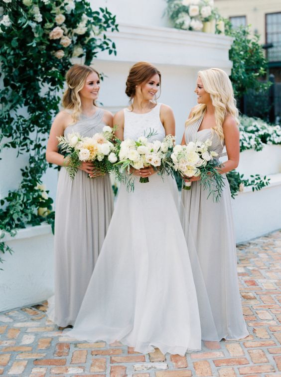 mismatched light grey maxi bridesmaid dresses with draped bodices and pleated skirts are pure elegance and chic