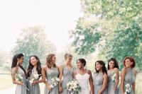 mismatching grey maxi bridesmaid dresses with pleated skirts and various necklines for a chic spring wedding