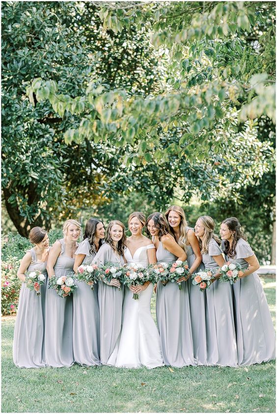 mismatching maxi bridesmaid dresses with pleated skirts and straps, ruffles for a spring or summer wedding
