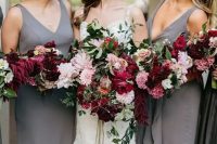 plain sheath bridesmaid dresses with deep neckline and thick straps and cascading pink and burgundy bouquets