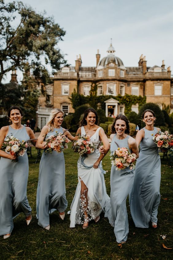 silver grey sleeveless maxi bridesmaid dresses with high necklines, white shoes for a chic spring wedding