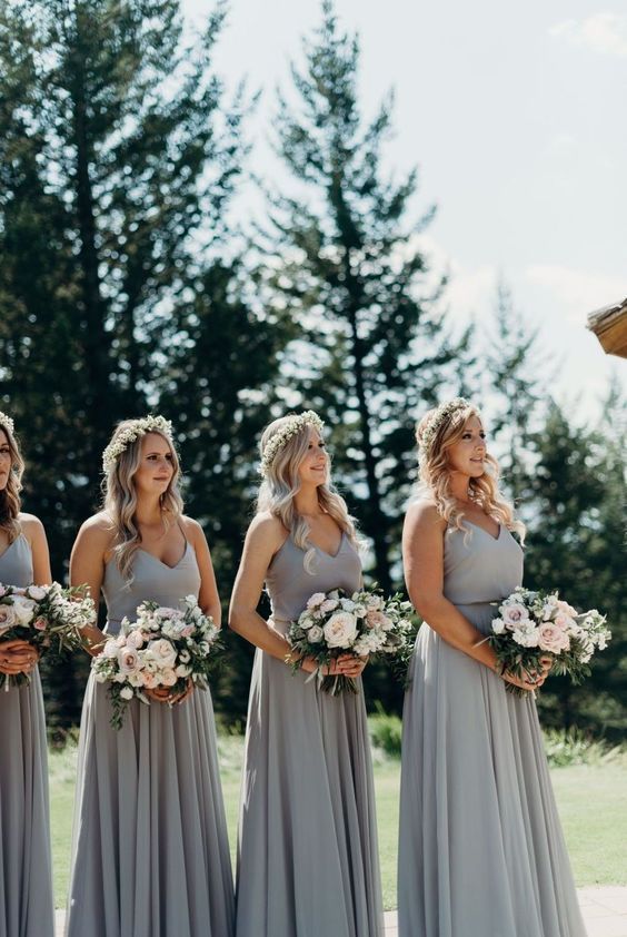 Simple matching dove grey maxi bridesmaid dresses with spaghetti straps and V necklines for a spring wedding