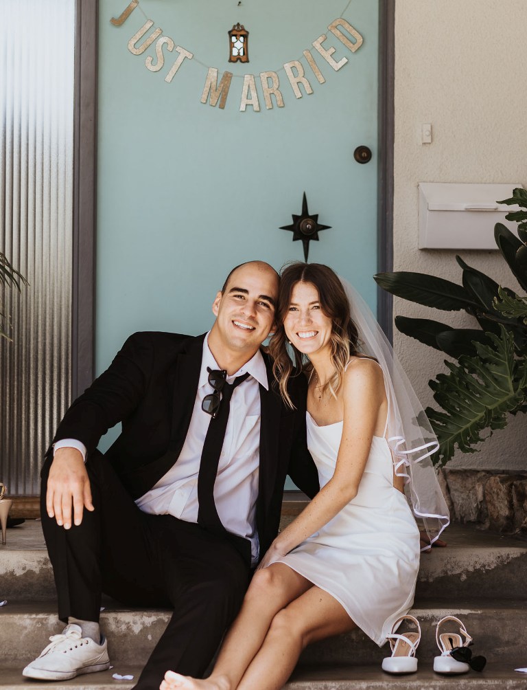 a couple sitting on their porch for a couple of cozy shots at their wedding is a lovely idea