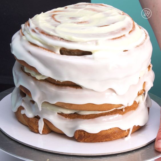 a cinnamon roll wedding cake fully covered with white icing is a lovely idea for a casual modern wedding