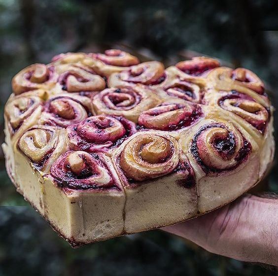 a fantastic heart-shaped cinnamon roll wedding cake with berries is a jaw-dropping and delicious idea