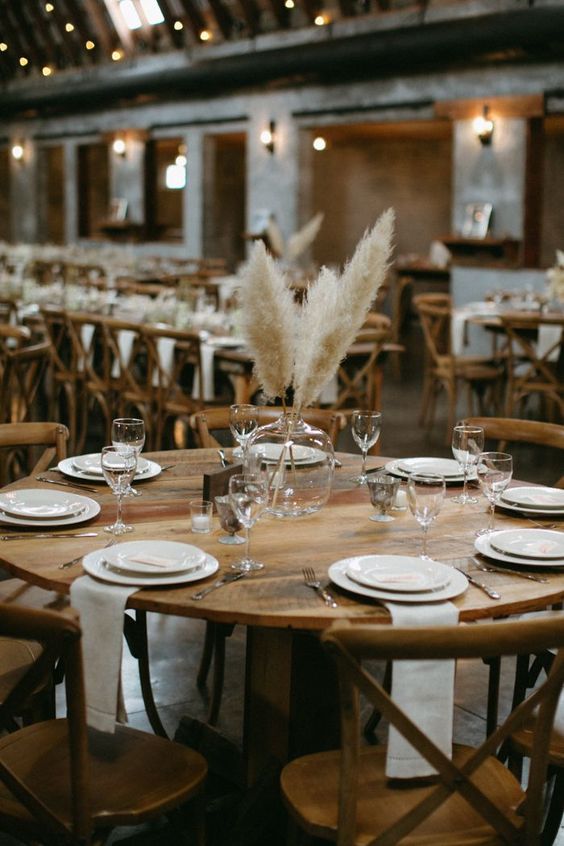 a large bottle with pampas grass is a bold and chic boho and mid-century modern centerpiece