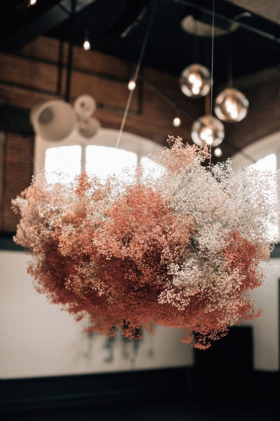 a lovely blush and white baby's breath chandelier will add a romantic touch to the space and will make it beautiful