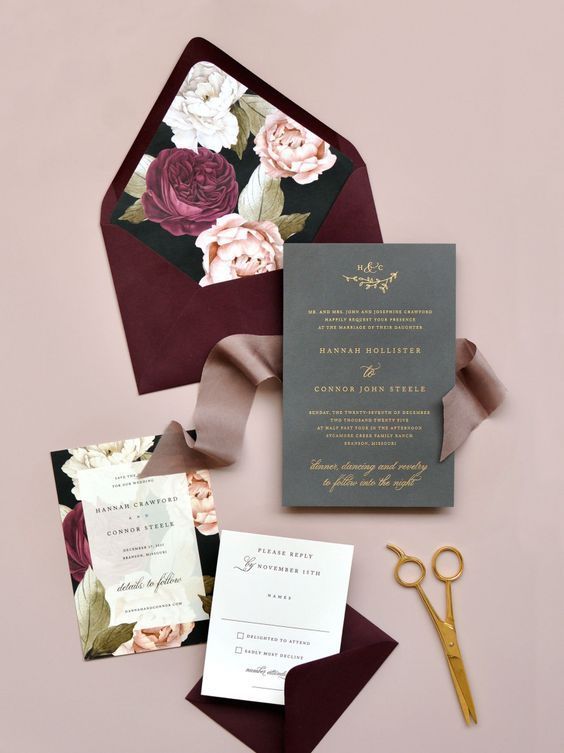 a bold fall wedding invitation suite with a burgundy envelope, bright floral lining and a grey invite plus a ribbon