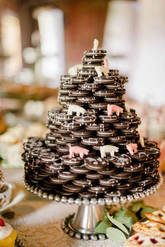 35 an Oreo cookie wedding cake with sugar animals and some white chocolate drip is a lovely and easy idea to rock