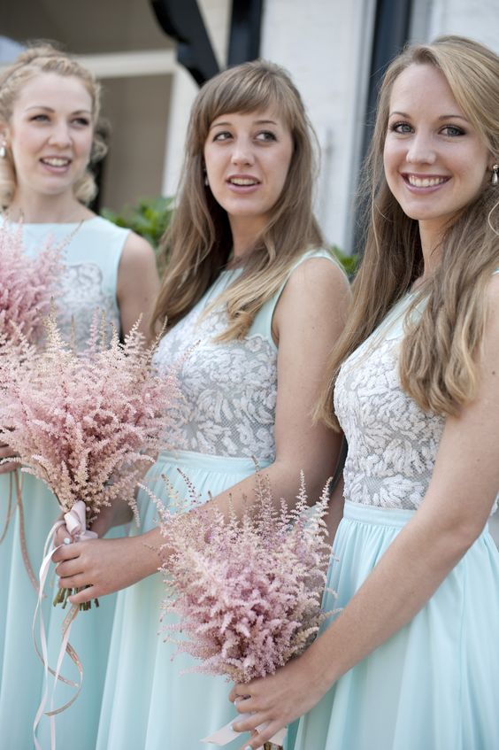 pretty pink astilbe bridesmaid bouquets with pink wraps and ribbons are a non-typical and bold idea to try