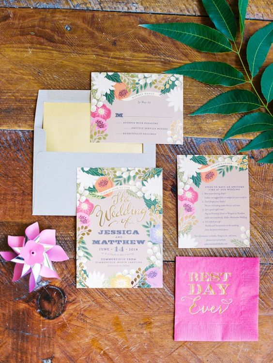 a bright tropical wedding invitation suite with hot pink and gold touches and with fun floral prints is amazing
