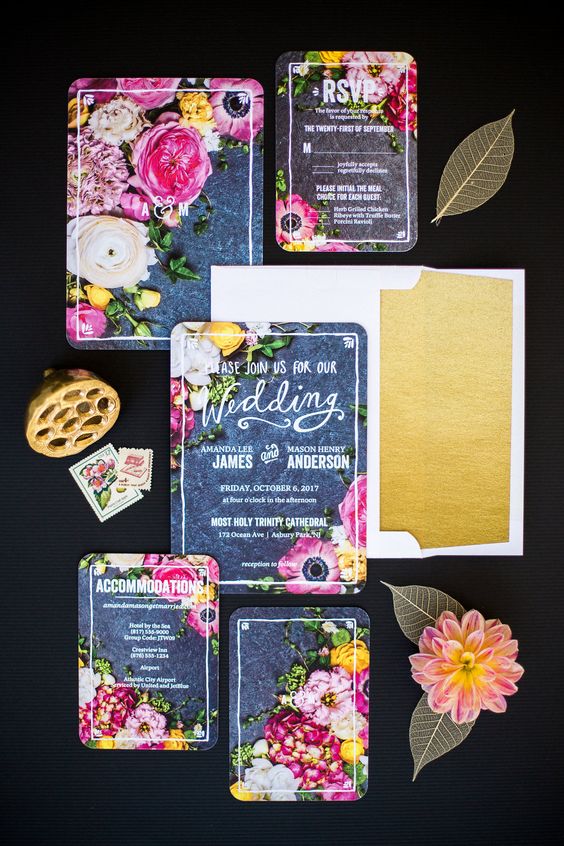 a creative wedding invitation suite with realistic floral prints and an envelope with gold glitter lining is gorgeous for summer