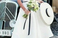 03 a retro nautical wedding dress of tea length, off the shoulder and with a catchy bodice plus black touches is wow