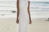 05 a minimalist yet classic white sheath dress with a high neckline and no sleeves is a classic and modern idea for a nautical wedding