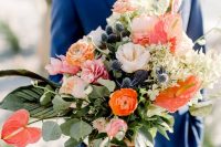 08 a colorful nautical wedding bouquet of orange and pink ranunculus and peonies, thistles, lots of leaves and greenery is wow
