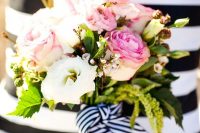 11 a bright nautical wedding bouquet of pink and white roses, greenery, waxflower and a striped ribbon is amazing