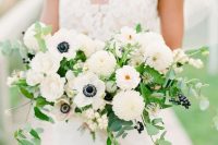 14 a beautiful modern nautical wedding bouquet of white anemones, dahlias, greenery, privet berries and some blooming branches