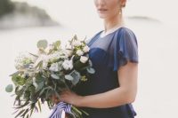 16 a modern navy A-line wedding dress with an illusion neckline, cap sleeves is a very elegant and fresh solution