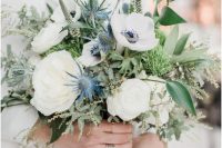 21 a heavenly beautiful nautical wedding bouquet of white roses and ranunculus, thistles, astilbe, greenery of various kinds