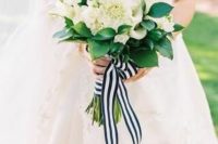 24 a nautical wedding bouquet composed of white dahlias and roses, with greenery and a striped ribbon is a gorgeous and classic idea