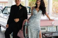 24 a silver sequin fitting wedding dress with a covered plunging neckline, a slit and matching silver boots for a nautical wedding