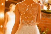 a beautiful celestial wedding gown with constellations, planets and stars embroidered on the dress is a gorgeous idea for a celestial bride
