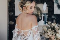 a chic fitting wedding dress with an off the shoulder neckline, a lace covered back and bell sleeves plus an illusion back just wows