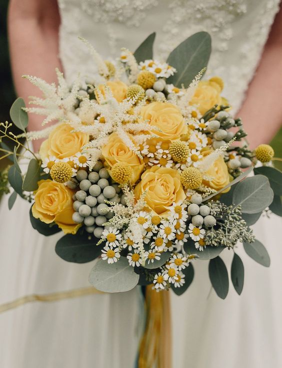 a chic wedding bouquet with yellow roses, white blooms, berries, astilbe, billy balls and eucalyptus is a beautiful idea