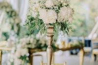 a tall centerpiece is a great addition to any wedding table