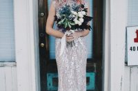 a sparkling silver sheath wedding dress with a small train, a high neckline and cap sleeves plus a floral crown for a celestial look