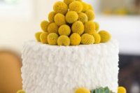a white buttercream wedding cake with billy balls and succulents is a lovely idea for a spring or summer wedding