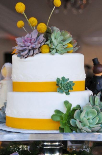 a white buttercream wedding cake with yellow ribbons, succulents and billy balls is a lovely idea for spring and summer