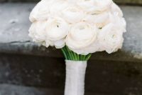 02 a classic white ranunculus wedding bouquet with a matching wrap is a stylish and absolutely timeless idea to rock