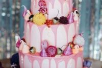 08 a fabulous wedding cake with pink drip, bright blooms and meringues is a gorgeous idea for a bright summer wedding