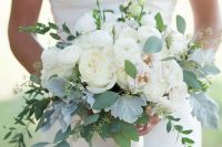 09 a classic wedding bouquet composed of white ranunculus and some pale foliage is a lovely idea for a modern neutral wedding