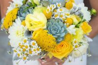 11 a bold summer wedding bouquet with succulents, yellow roses, mimosas, billy balls and pale foliage is wow