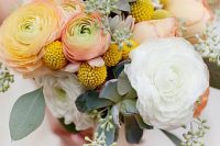 19 a bright wedding bouquet with yellow and white ranunculus, billy balls, greenery and succulents is ideal for spring or summer