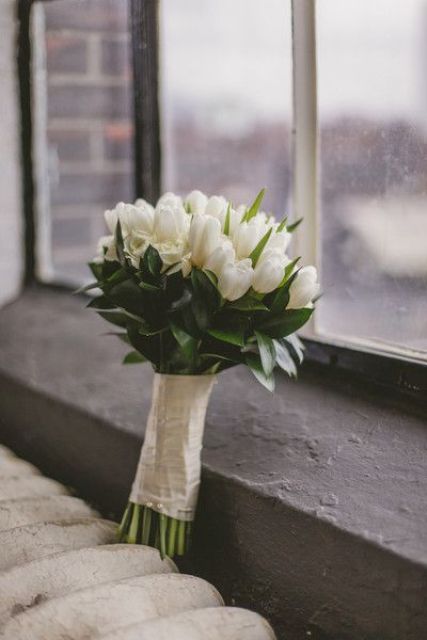a white tulip wedding bouquet is classics for a spring bride, and you can easily compose one yourself without any help