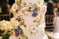 33 a whimsical secret garden wedding cake in white, with fresh and sugar blooms, grapes and leaves is amazing